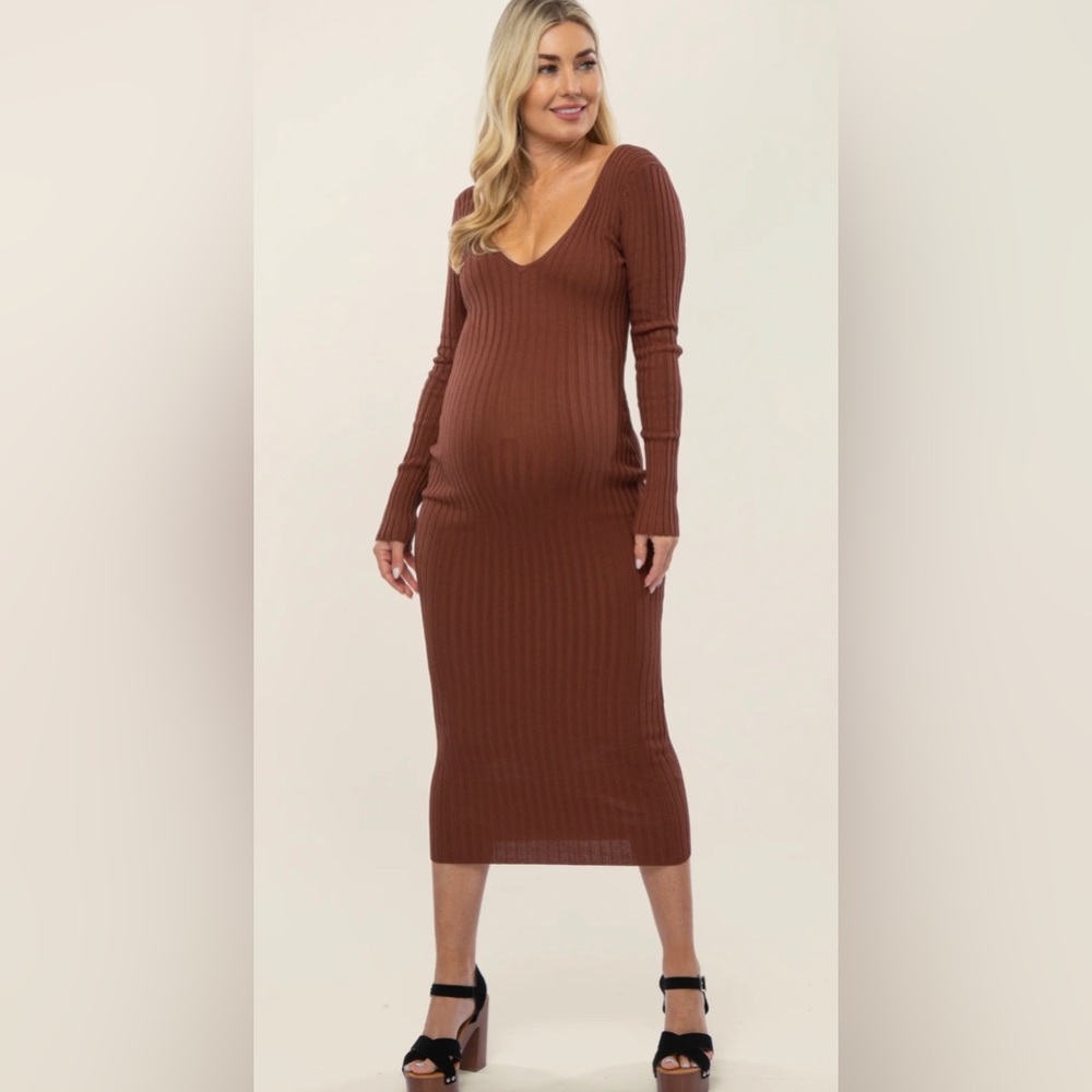 A solid hued fitted maternity maxi dress featuring long sleeves and a v-neckline